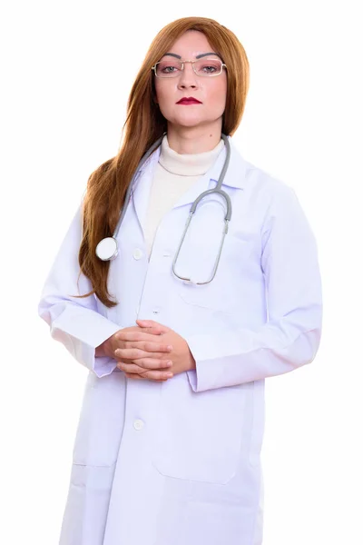 Estúdio tiro de mulher médico de pé com as mãos juntas — Fotografia de Stock