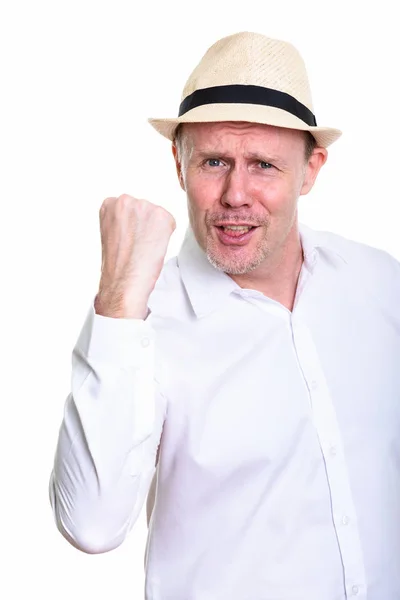 Studio shot of happy mature man smiling while looking motivated — Stock Photo, Image