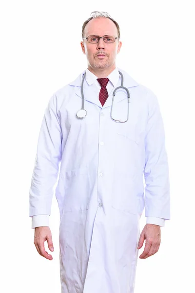 Studio shot of mature man doctor standing — Stock Photo, Image