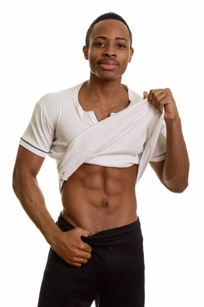 Ung afrikansk man visar abs — Stockfoto