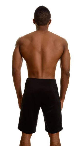 Visão traseira do jovem bonito homem africano sem camisa com m definido — Fotografia de Stock