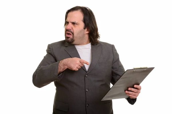 Gordo caucásico hombre de negocios mirando enojado señalando y sosteniendo cli —  Fotos de Stock