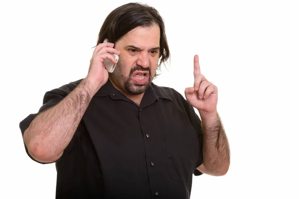 Irritado gordura caucasiano homem falando no celular enquanto apontando f — Fotografia de Stock