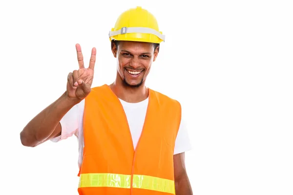 Junger glücklicher afrikanischer Mann Bauarbeiter lächelt beim Geben — Stockfoto