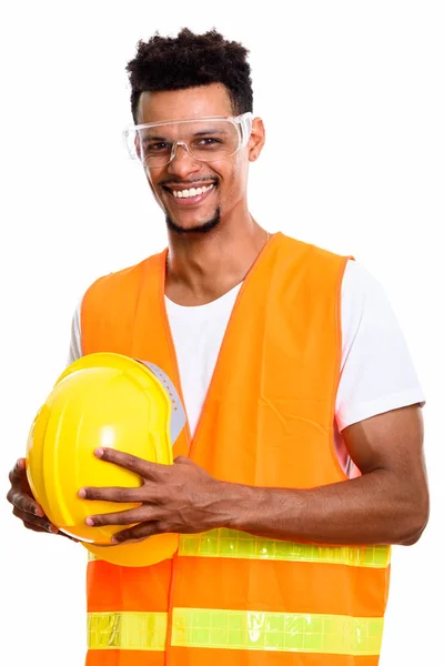 Doordachte gelukkig Afrikaanse man bouwvakker glimlachen terwijl h — Stockfoto