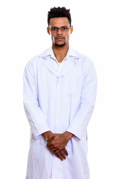 Studio shot of young African man doctor standing with hands toge — Stock Photo, Image