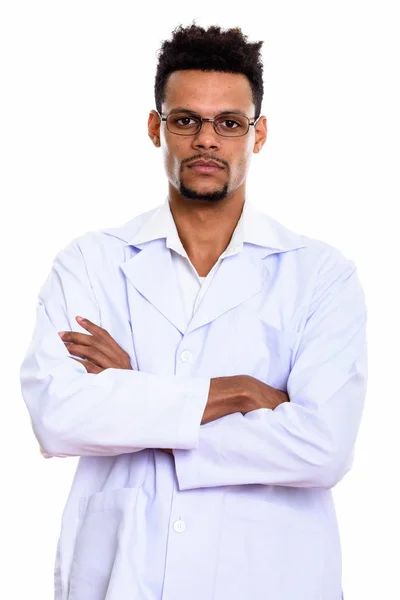 Studio shot of young African man doctor with arms crossed — Stock Photo, Image