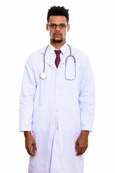 Studio shot of young African man doctor standing while wearing e — Stock Photo, Image