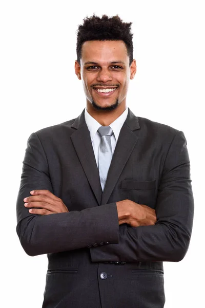 Studio shot of young happy African businessman smiling with arms — Stock Photo, Image