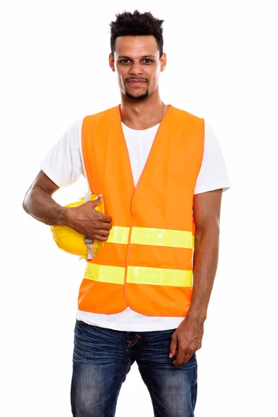 Young African man construction worker holding safety helmet — Stock Photo, Image