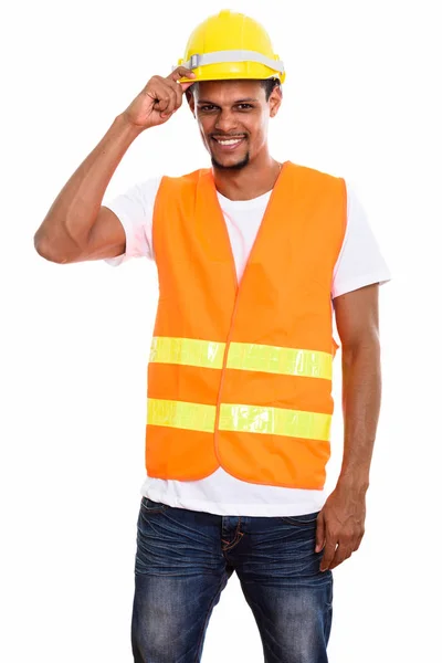 Young happy African man construction worker smiling while holdin — Stock Photo, Image