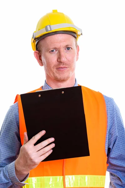 Estudio de hombre trabajador de la construcción sosteniendo portapapeles —  Fotos de Stock