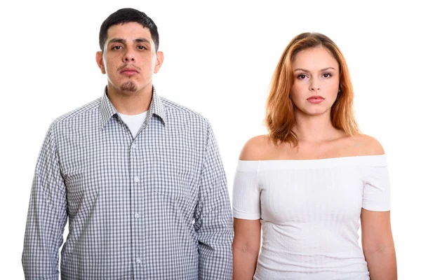 Studio shot of young couple looking at camera together — Stock Photo, Image