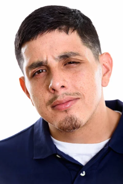 Face of young Hispanic man looking confused — Stock Photo, Image