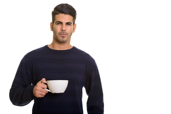 年轻英俊的波斯男人拿着咖啡杯 — 图库照片