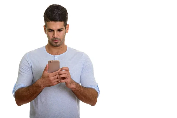 Young handsome Persian man using mobile phone — Stock Photo, Image