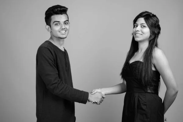 Young Indian man and young Indian woman together