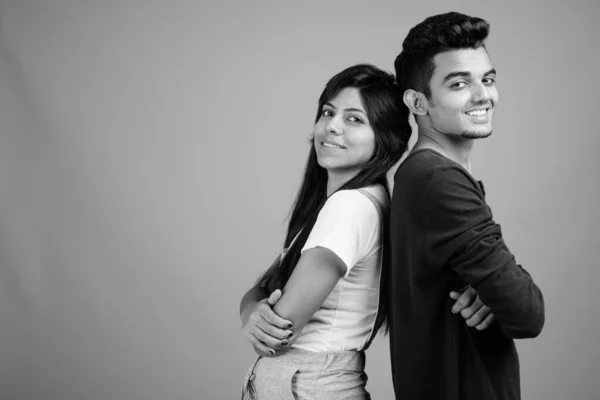 Young Indian man and young Indian woman together