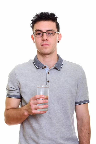 Studio shot of young handsome man isolated against white background — Stock Photo, Image