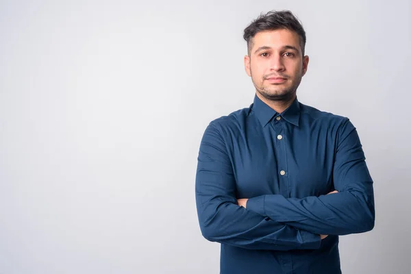 Portrait of young handsome Persian businessman with arms crossed — Stock Photo, Image