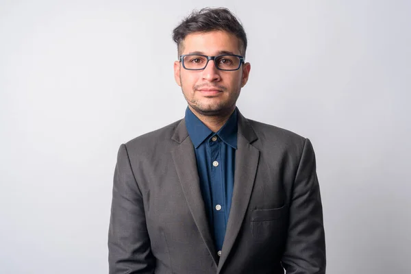 Portrait of young Persian businessman in suit with eyeglasses — Stok fotoğraf