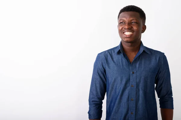 Studio shot of young happy black African man smiling and thinkin — Stock Photo, Image