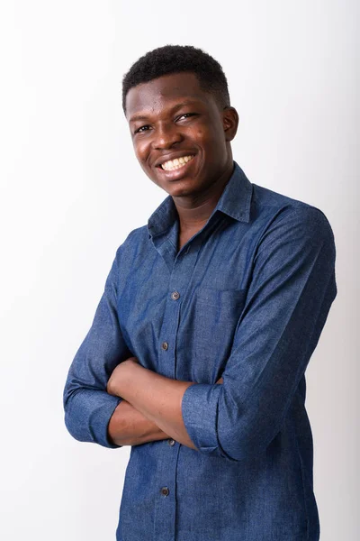 Studio shot of young happy black African man smiling with arms c — Stock Photo, Image