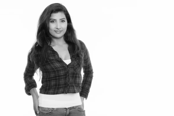 Studio shot of young happy Persian woman smiling — Stock Photo, Image