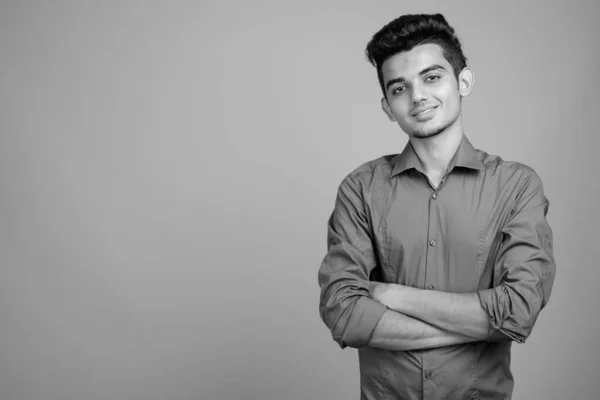 Portrait of young Indian businessman in black and white — ストック写真