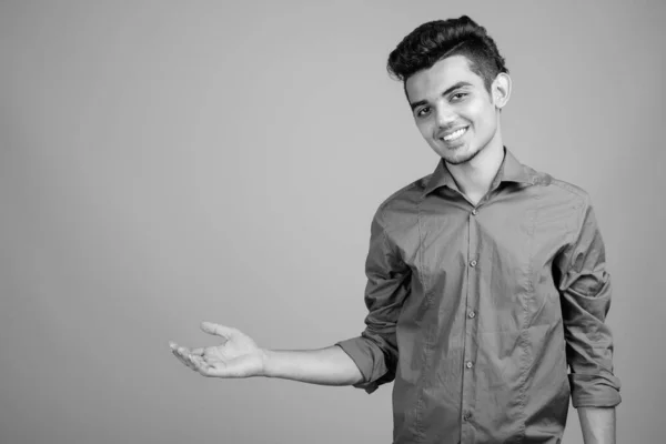 Portrait of young Indian businessman in black and white — ストック写真