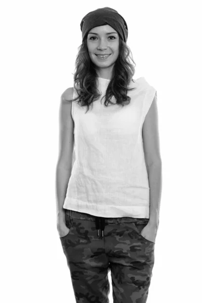 Studio shot of young happy woman smiling and standing — Stock Photo, Image