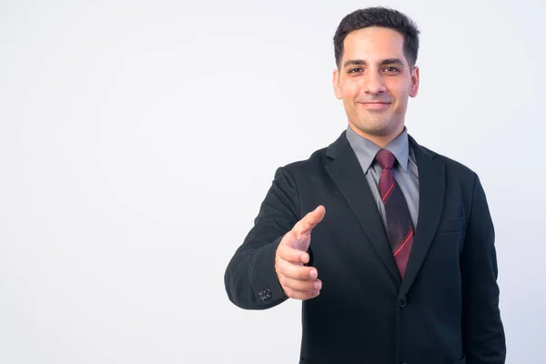 Portret van knappe Perzische zakenman in pak die handdruk geeft — Stockfoto