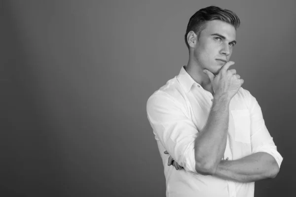 Portrait of young handsome businessman in black and white — Stock Photo, Image