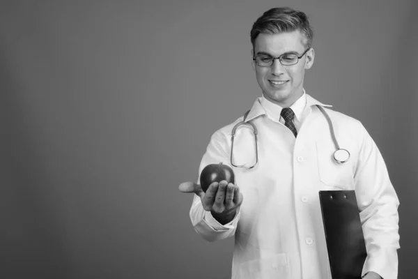 Portrait of young handsome man doctor with eyeglasses in black and white — Zdjęcie stockowe