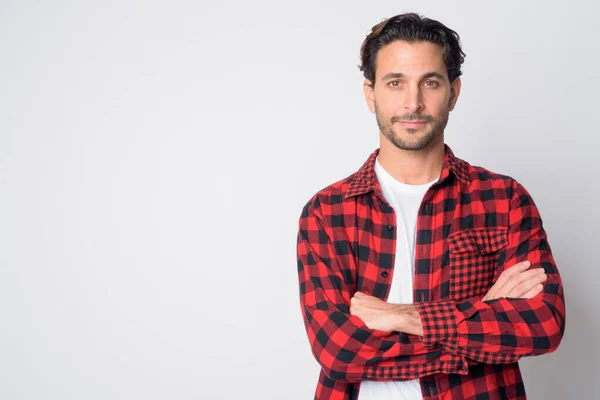 Portrait of handsome Hispanic hipster man with arms crossed — Stock Photo, Image