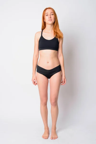 Full body shot of young beautiful redhead woman in lingerie — ストック写真