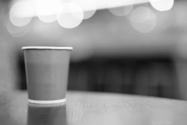 Hot Coffee In Paper Cup Placed On Wooden Table In Black and White — Stok Foto