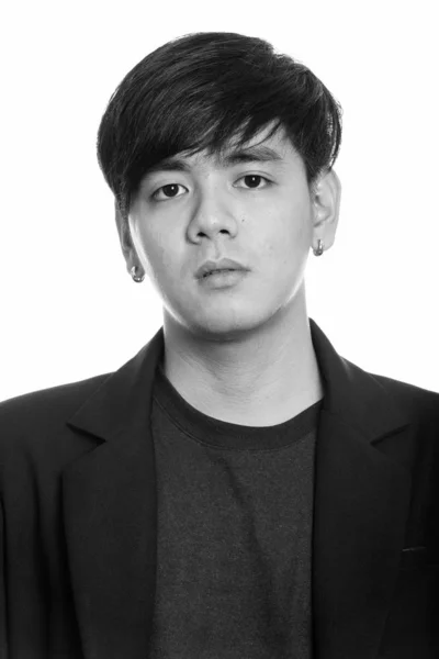 Face of young handsome Asian businessman in black and white — Stock Photo, Image