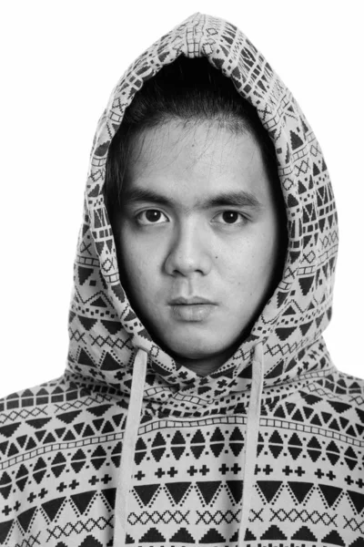 Face of young handsome Asian man wearing hoodie — Stock Photo, Image