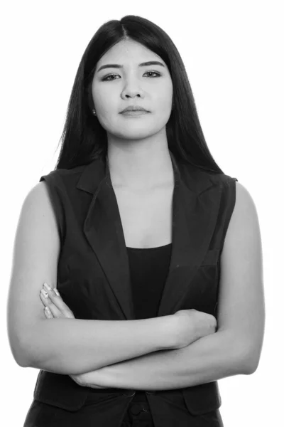 Studio shot of young Asian woman with arms crossed — Stock Photo, Image