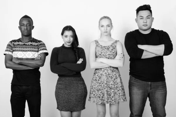 Studio shot of diverse group of multi ethnic friends with arms crossed together — Stock Photo, Image