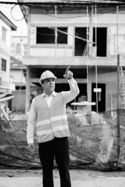 Handsome Persian man construction worker at the construction site