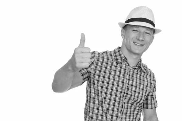 Studio shot of young happy Caucasian man giving thumb up isolated against white background — Stock Photo, Image