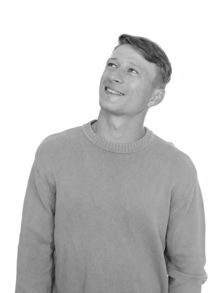 Studio shot of young happy Caucasian man thinking isolated against white background — Stock Photo, Image