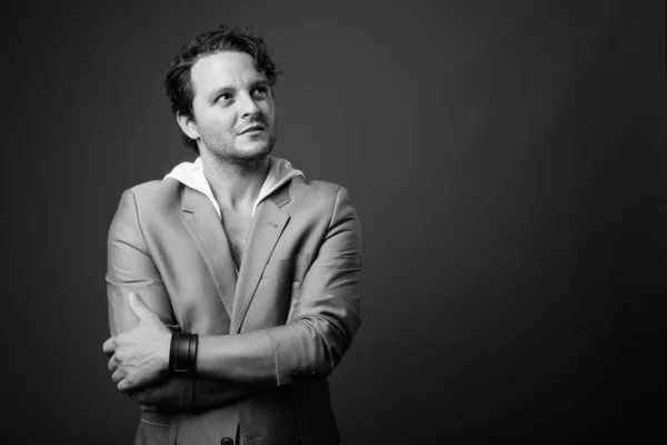 Studio shot of Italian businessman in black and white Stock Picture