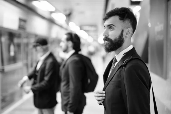 Multi ethnic bearded businessmen together around the city