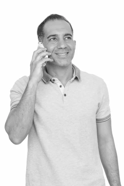 Mature happy Persian man talking on mobile phone — Stock Photo, Image