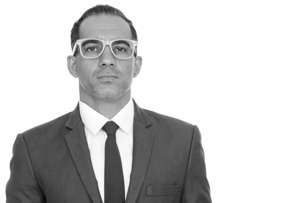 Mature handsome Persian businessman with eyeglasses in black and white — Stock Photo, Image