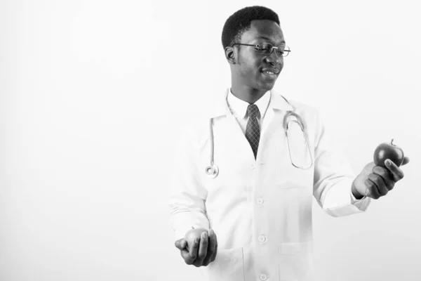 Young handsome African man doctor wearing eyeglasses against white background — Stock Photo, Image