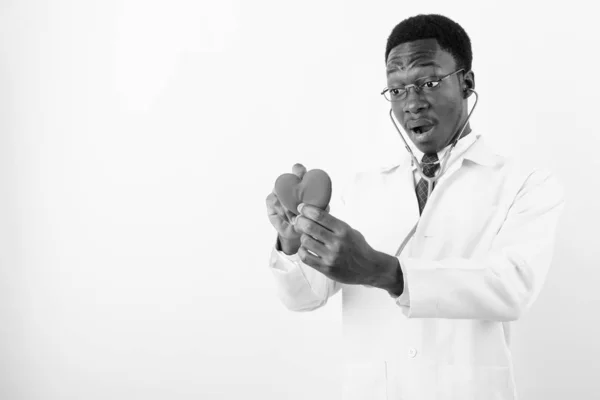 Young handsome African man doctor wearing eyeglasses against white background — Stock Photo, Image